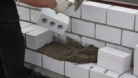 Bricklayer, masonry brick trowel in hand, mortar, brick Video stock 300760383