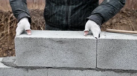 Bricklayer mortar to build the wall Stock Footage 57780778