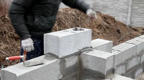 Bricklayer mortar to build the wall Stock Footage 57780785