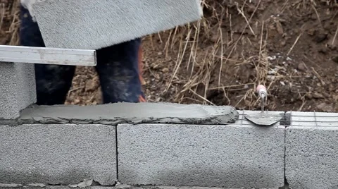 Bricklayer mortar to build the wall Stock Footage 57780810