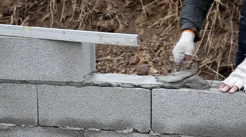 Bricklayer mortar to build the wall Stock Footage 57780831