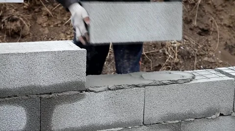 Bricklayer mortar to build the wall Stock Footage 57781178