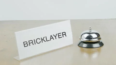 Bricklayer Office or Room with Hand Ringing The Bell on Desk or Table Stock Footage 300612183