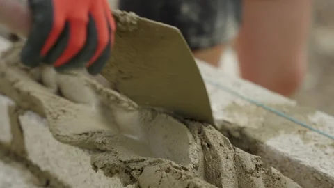 Bricklayer Puts Mortar On Wall Video stock 239679335
