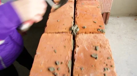 A bricklayer putting bricks being very concentrated Stock Footage 68807277
