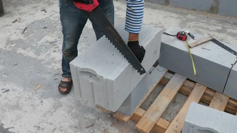 Bricklayer putting down another row of bricks in site Stock Footage 113408010