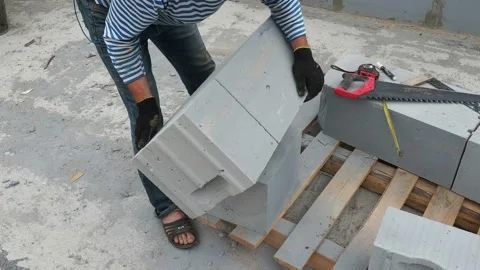 Bricklayer putting down another row of bricks in site Stock Footage 113408182