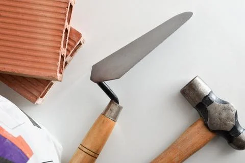 Bricklayer tools and materials on white background Stock Photos