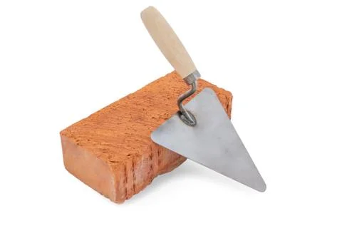 Bricklayer tools. Brick and trowel isolated on white background. Concept of t Stock Photos