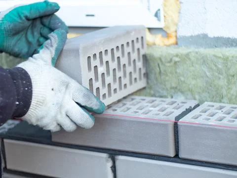 A bricklayer at work. construction of a brick house Stock Photos