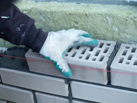 A bricklayer at work. construction of a brick house Stock Photos