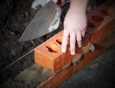Bricklayer at work Stock Photos