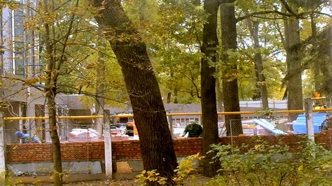 Bricklayers Do The Brick Wall On The Outdoor Near The Graders Stock Footage 103632441