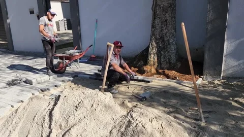 Bricklayers doing sidewalk in Sao Paulo, Brazil - Jun 2025 Stock Footage 314918272