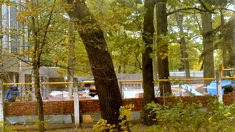 Bricklayers Make Brick Wall Near Graders In Timelapse Mode Stock Footage 103719190