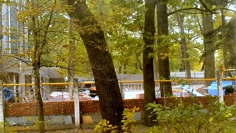 Bricklayers Make Brick Wall Near Graders In Time Back Mode Video stock 103719234