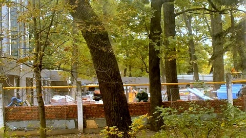 Bricklayers Make Brick Wall On The Outdoor Near The Graders Stock Footage 103719194