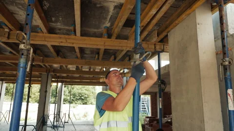 Bricklayers Working on Building Construction, Bricklayers are working on a multi Stock Footage 281181993