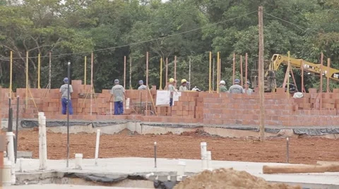 Bricklayers working at a construction site Stock Footage 47248956