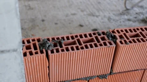 Bricklaying Close-Up: Red Brick Wall Construction Stock Footage 271583925