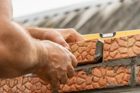 Bricklaying with hand tools during construction close-up Stock Photos