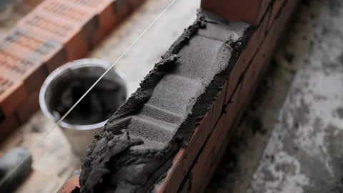 Bricklaying with mortar on construction site Stock Footage 315562734