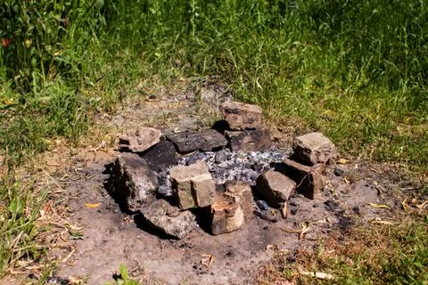 Bricks and campfire in the forest Foto stock
