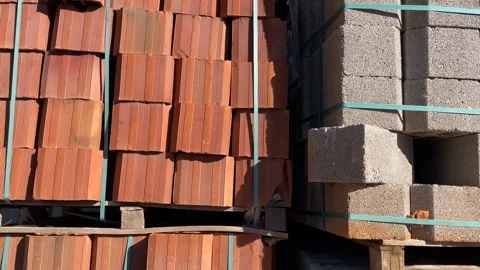 Bricks and concrete blocks stacked at construction site with sunlight and s.. Stock Footage 329585284