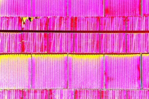 Bricks are stacked in a cube, stack for construction, brick background. Cha.. Stock Photos