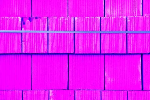 Bricks are stacked in a cube, stack for construction, brick background. Cha.. Stock Photos