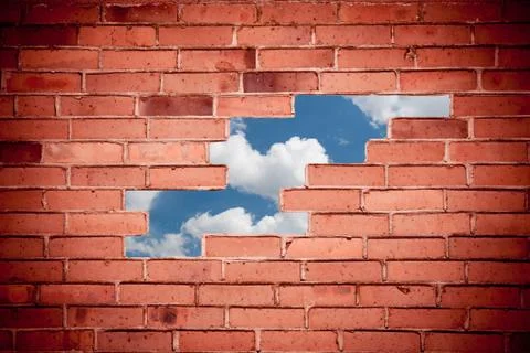 Bricks broken wall blue sky view Stock Photos