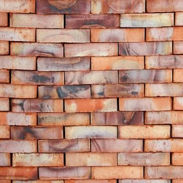Bricks with colored stains stacked on top of each other. Stock Photos