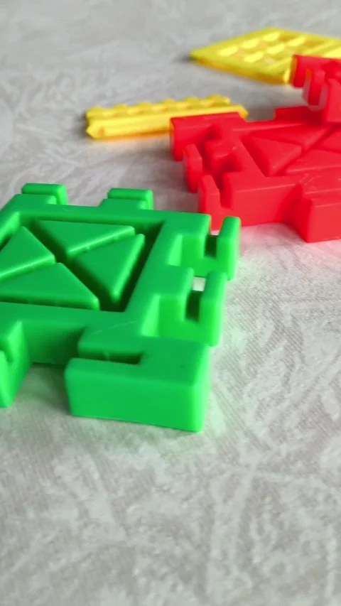 The bricks of the construction set are scattered on the table. Educational toys Stock Footage 318205243