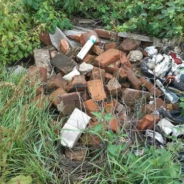 Bricks in the garbage can Stock Photos