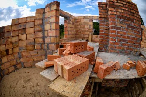 Bricks at house construction site Stock Photos