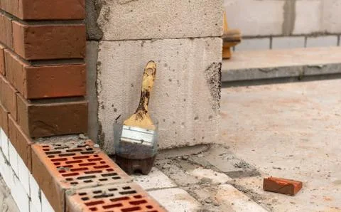 Bricks on a house under construction. Stock Photos