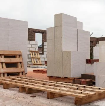Bricks on a house under construction. Stock Photos