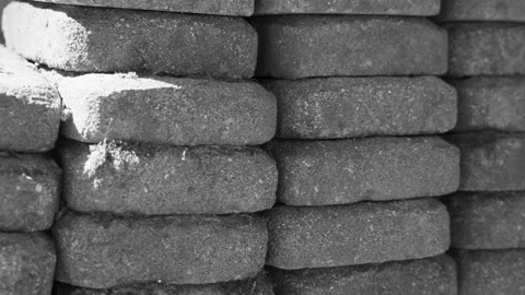 Bricks for landscaping and wall retention shot in black and white. Stock Footage 340922618