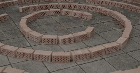 Bricks layed in circular form on pavement Stock Footage 300476290
