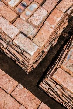 Bricks neatly stacked in square stacks by the building site Fotos de archivo