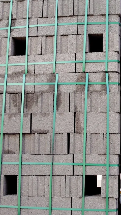 Bricks on pallets at construction site. Pallet stacked bricks, construction site Stock Footage 263070455