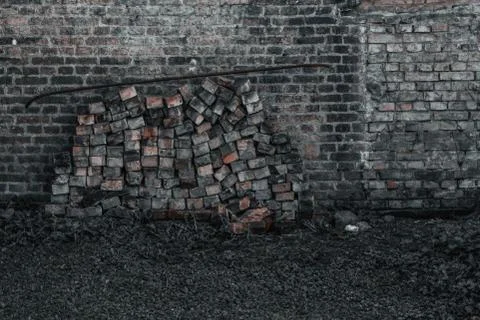 Bricks piled near an old wall in an old european city Stock Photos