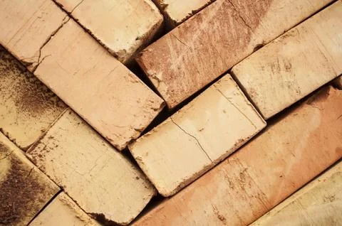 Bricks stacked in piles /bricks background Stock Photos