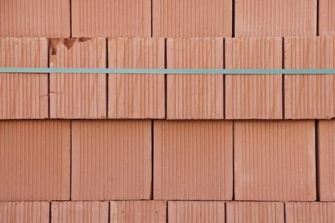 Bricks stacked in piles, stack for construction, Bricks background. Stock Photos