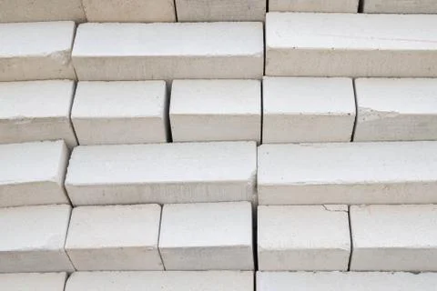 Bricks stacked in a warehouse building base Stockfoto's