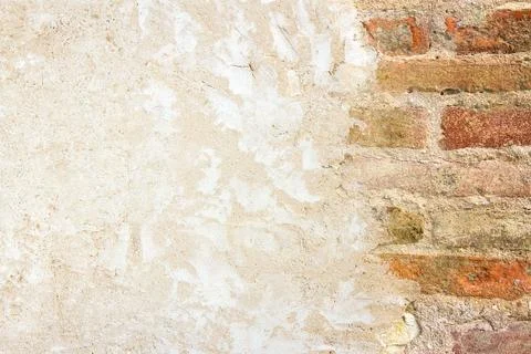 Brickwall with plastered wall Stock Photos