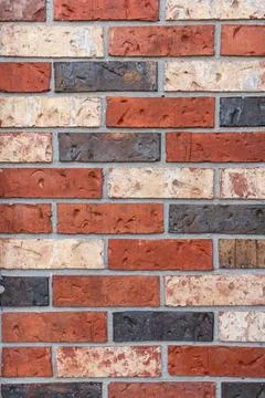 Brickwall with red and brown bricks, full frame background. Stock Photos