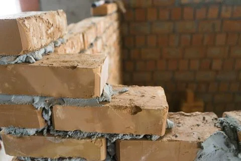 Brickwork of brick, folded in a certain way and fixed with mortar. industrial Stock Photos