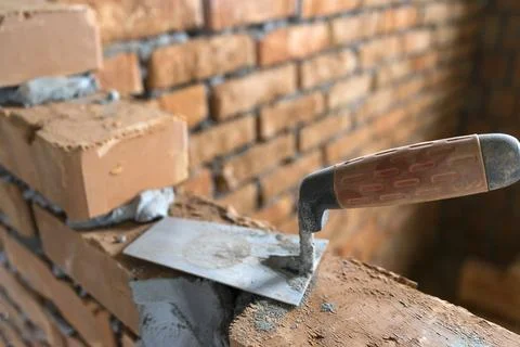 Brickwork of brick, folded in a certain way and fixed with mortar. industrial Stock Photos