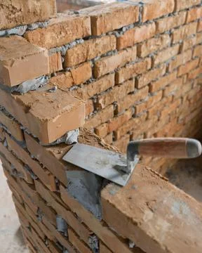 Brickwork of brick, folded in a certain way and fixed with mortar. industrial Stock Photos